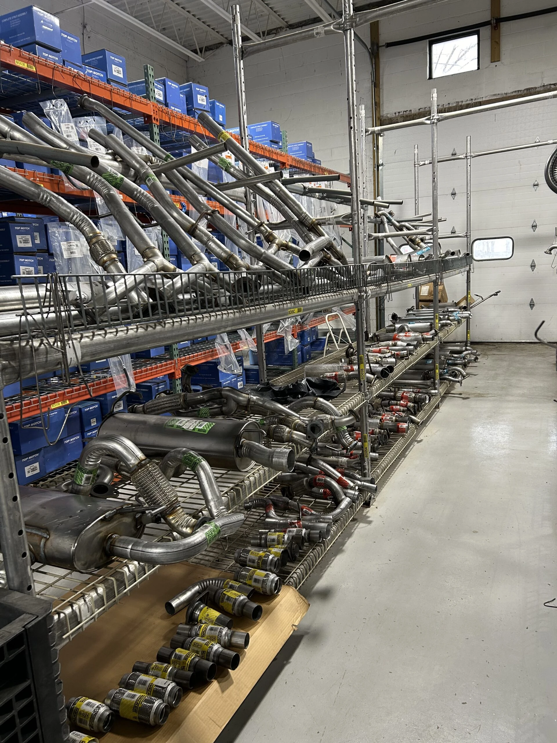 Racks of exhausts stocked in the United Auto Supply store in Fulton.