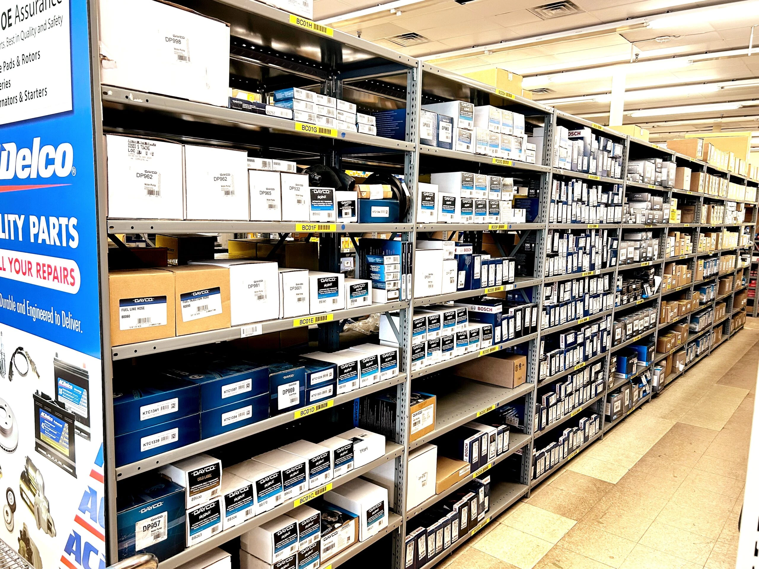 Rows of racks containing auto parts and auto related product that are stocked at United Auto Supply in Burnt Hills.