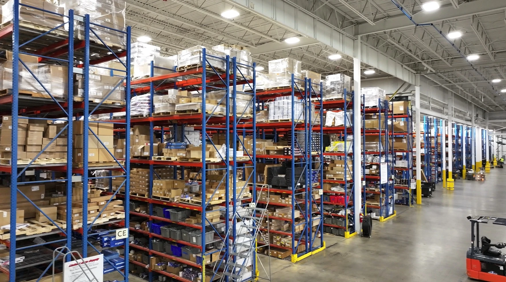 Rows of large racks containing auto parts and auto related product that are distributed from the United Auto Supply distribution center in Syracuse.
