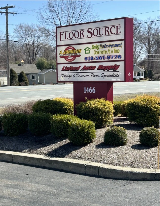 Complex sign displaying the United Auto Supply logo.