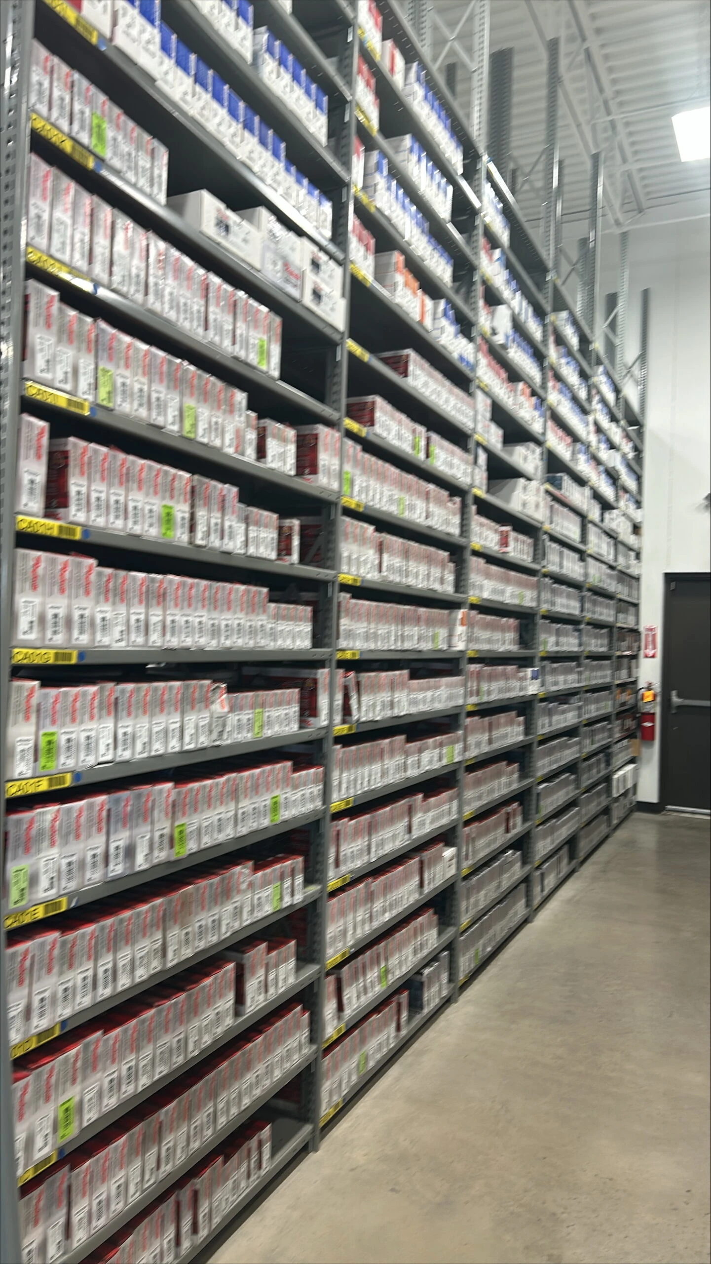 Racks of auto parts inventory stocked in UAS Syracuse.