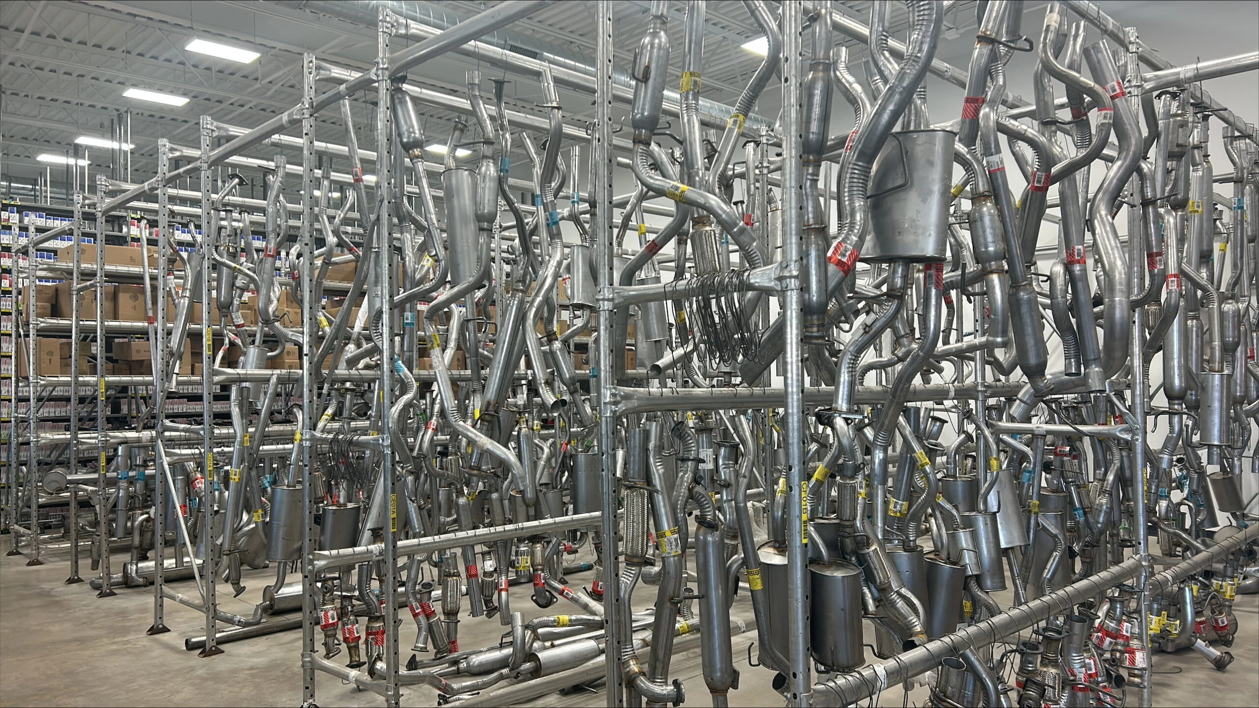 A rack full of exhausts that are stocked at United Auto Supply in Syracuse.