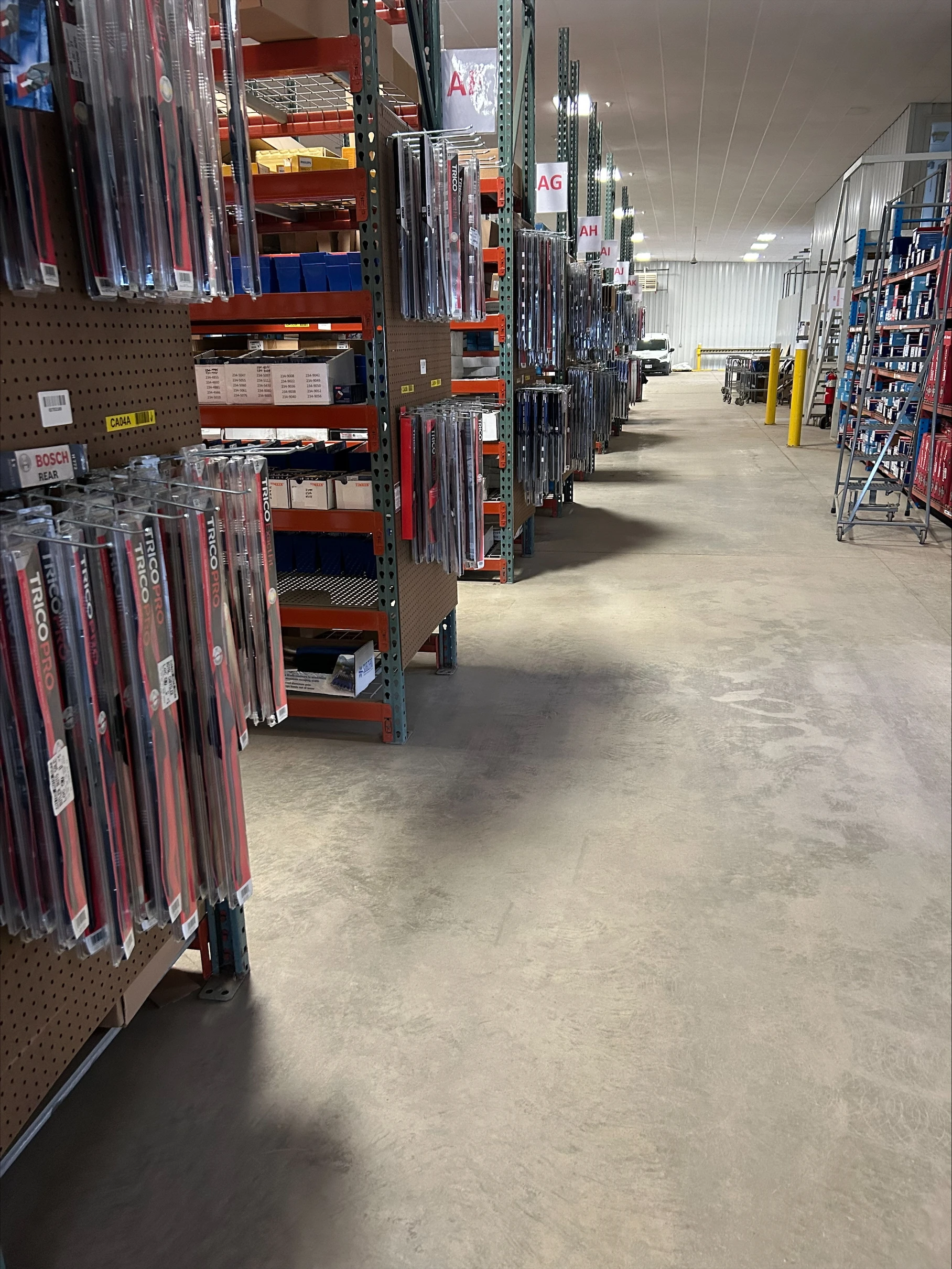 Racks of auto parts inventory stocked at United Auto Supply in Oneonta.