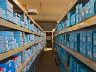 Rows of racks containing auto parts and auto related products that are stocked in the United Auto Supply store in Clifton Park.