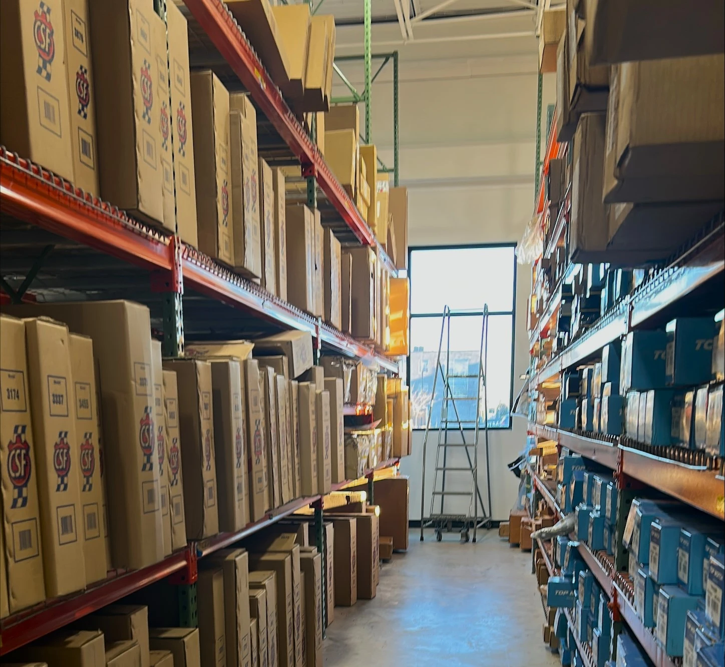 Racks of auto parts inventory stocked in UAS Syracuse.