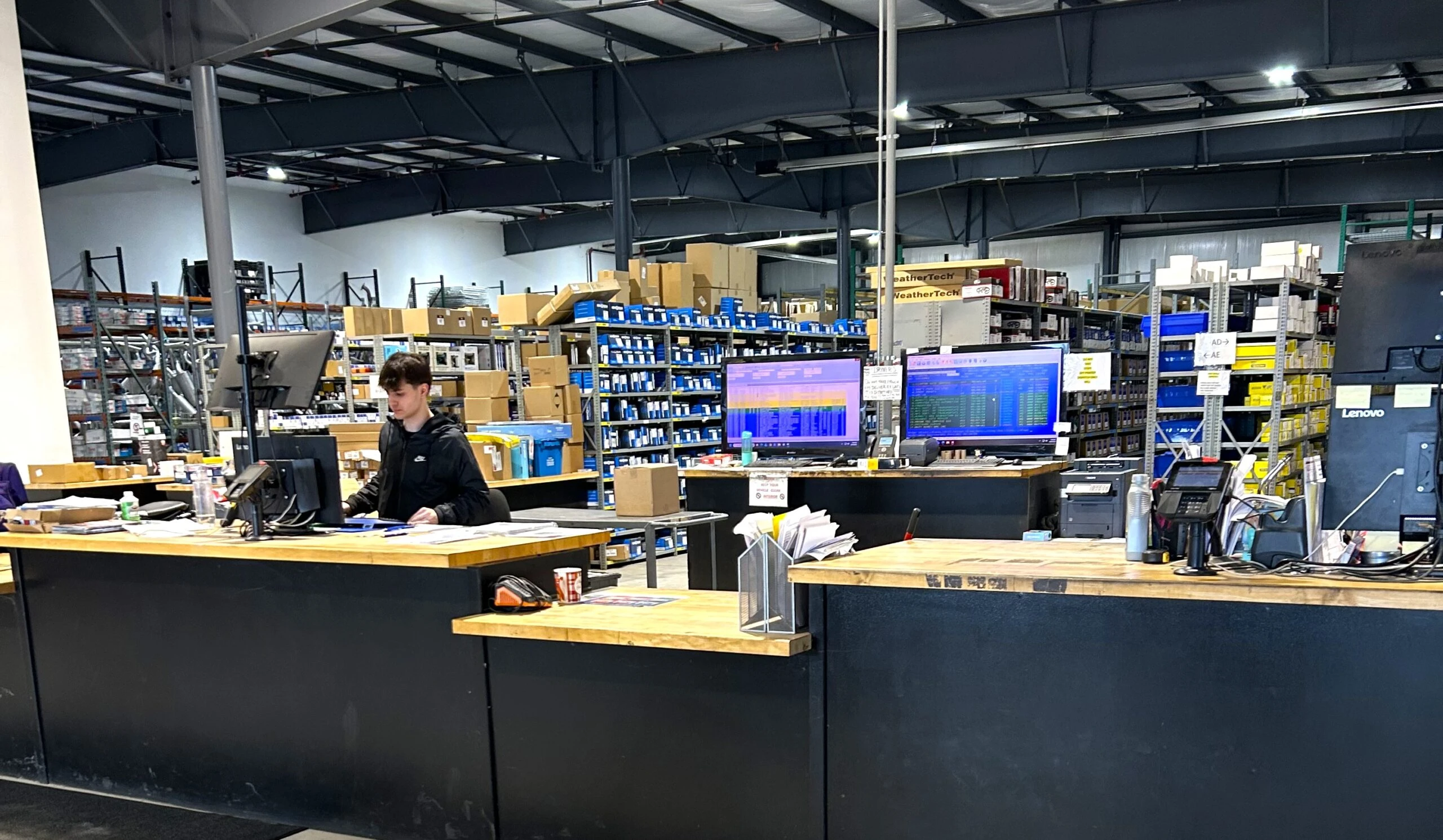 The counters at United Auto Supply store in Utica, with employees working behind the screens