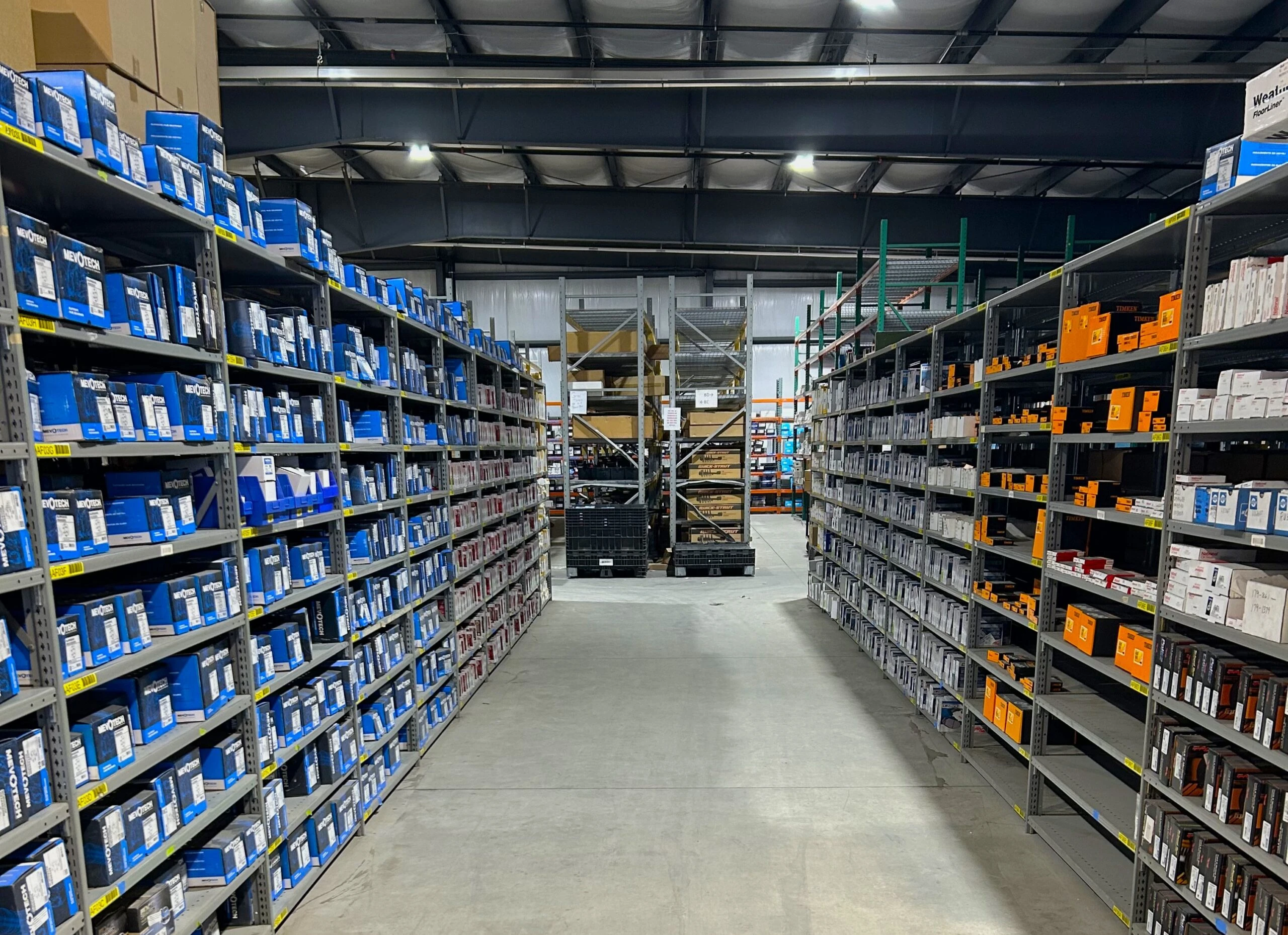 Racks of auto parts inventory that are available at the Utica store.