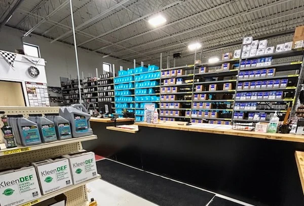 An overview of the inside of the United Auto Supply store in Fulton, displaying inventory and the customer counter.