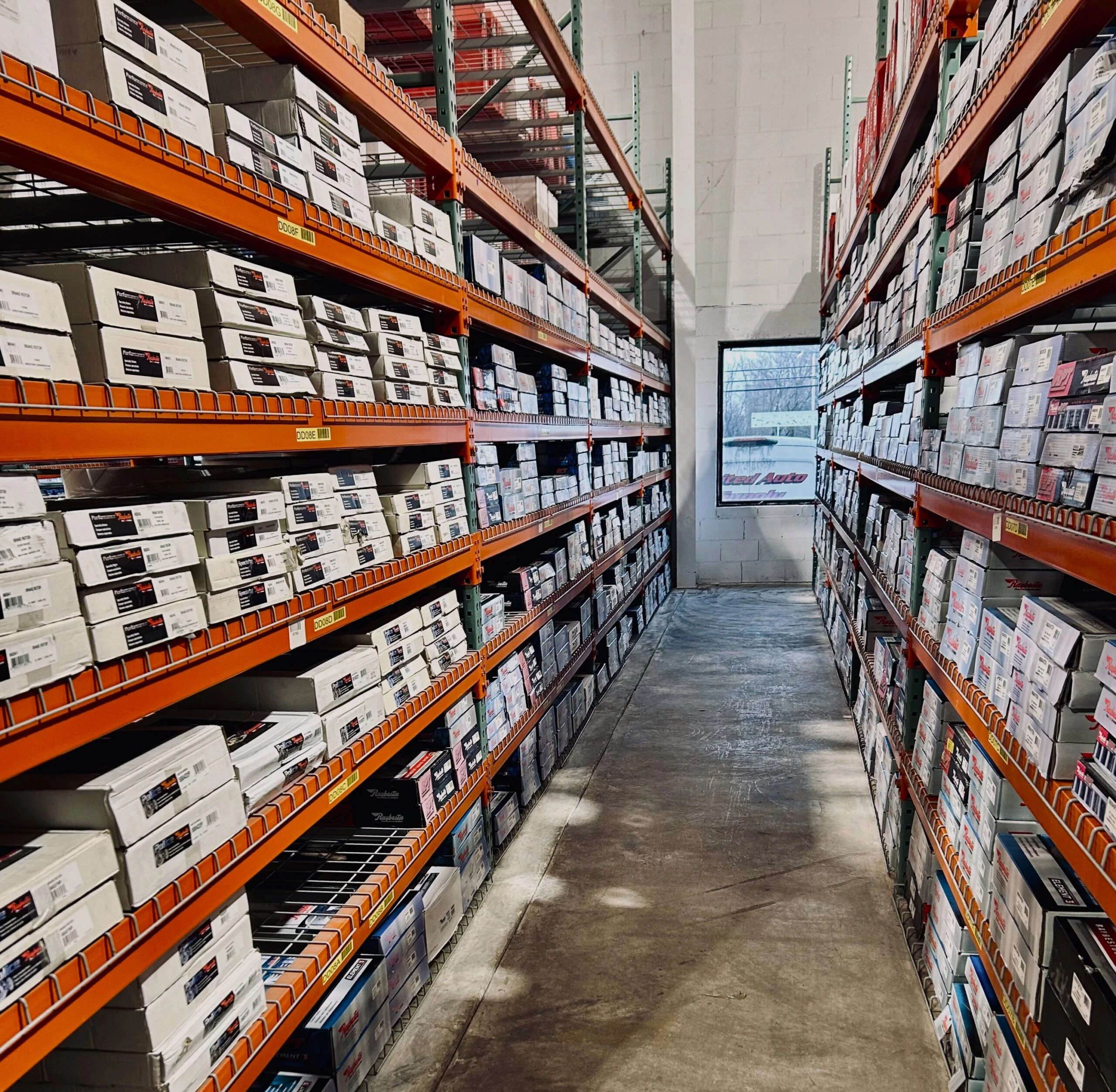 Aisles of racks of auto parts stocked at United Auto Supply, Queensbury.