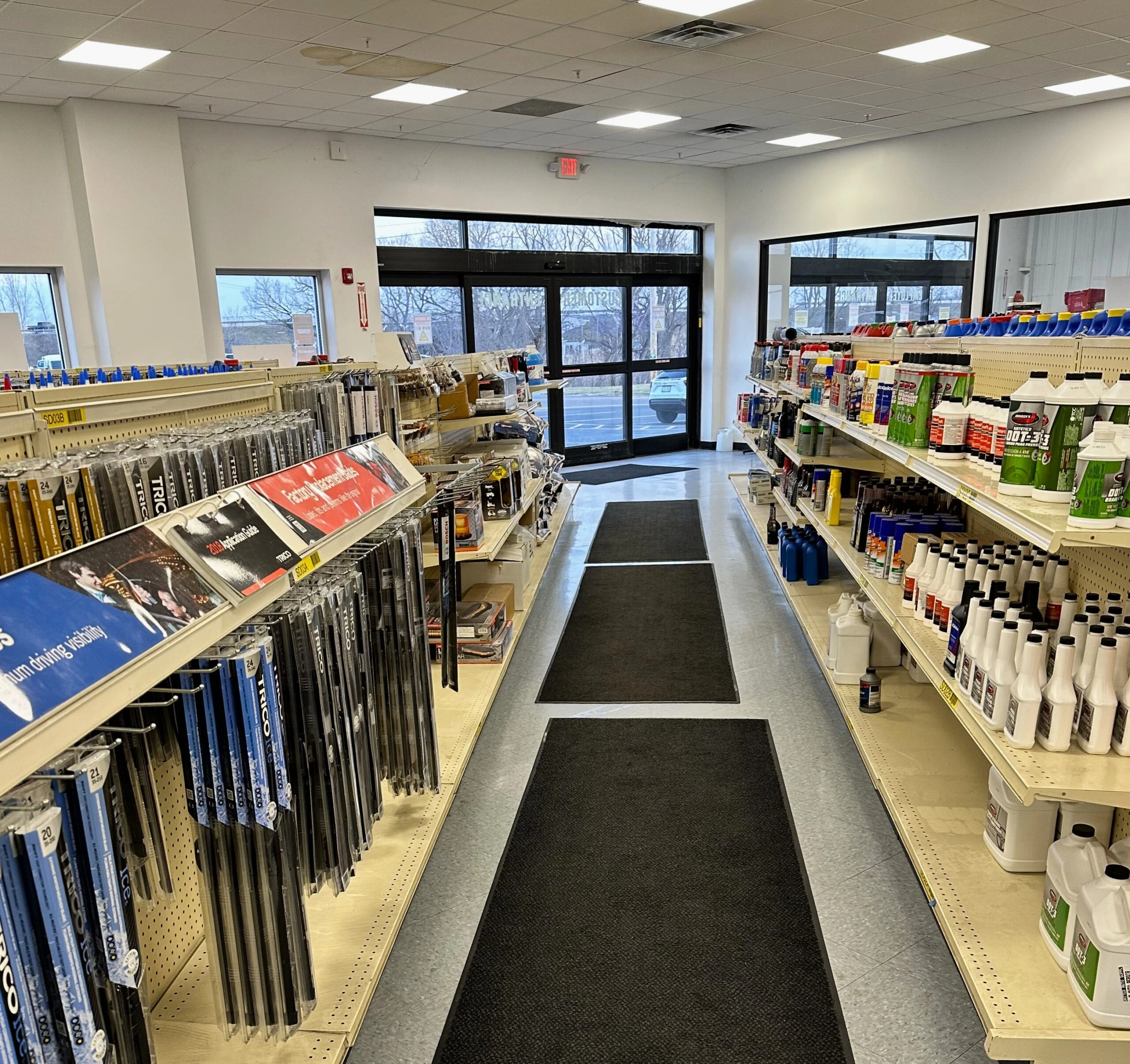 Aisles in the store front with auto parts and auto related products.