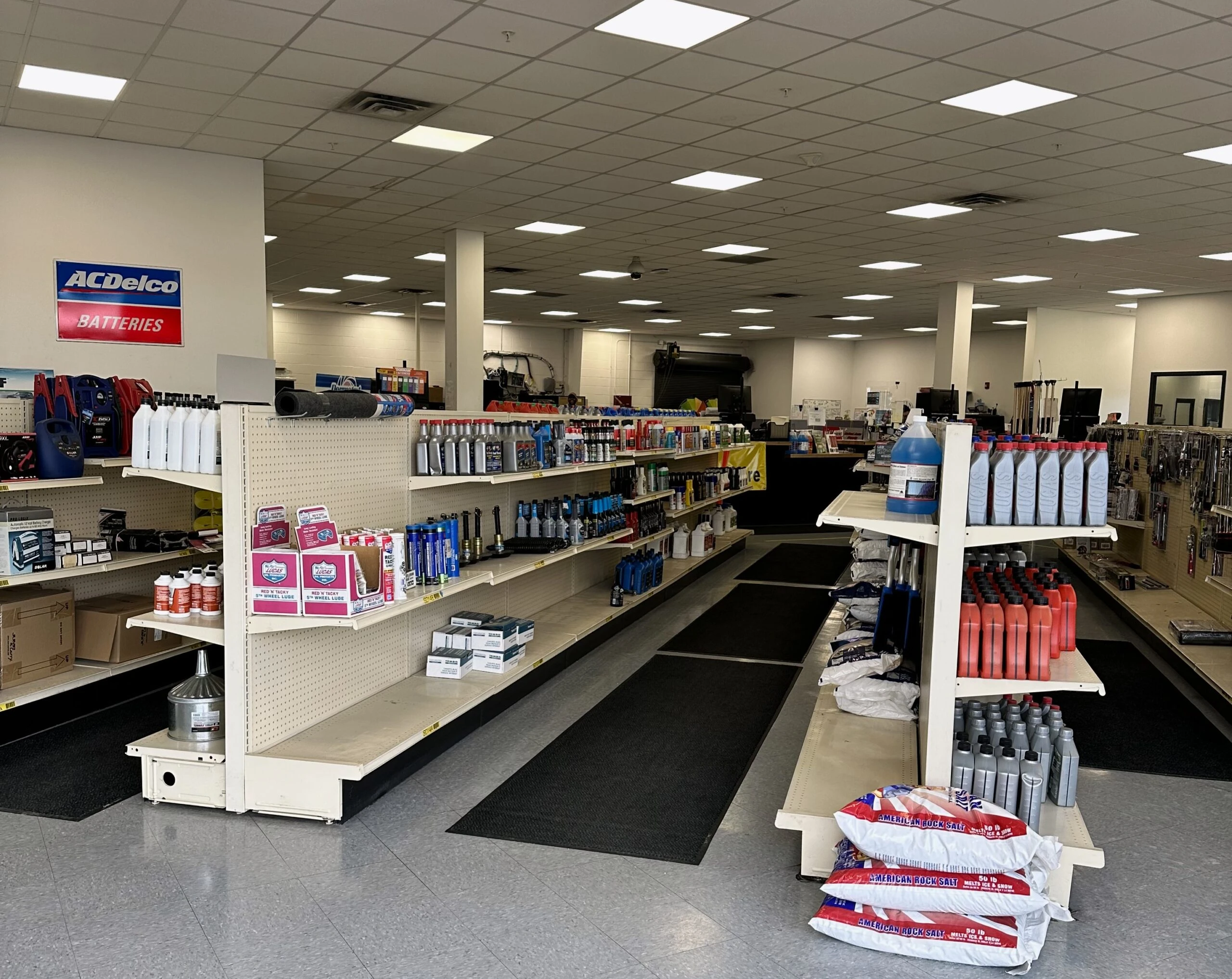 The inside view of the store front, showing the aisles of everyday auto parts customers might need at the United Auto Supply store in Syracuse.