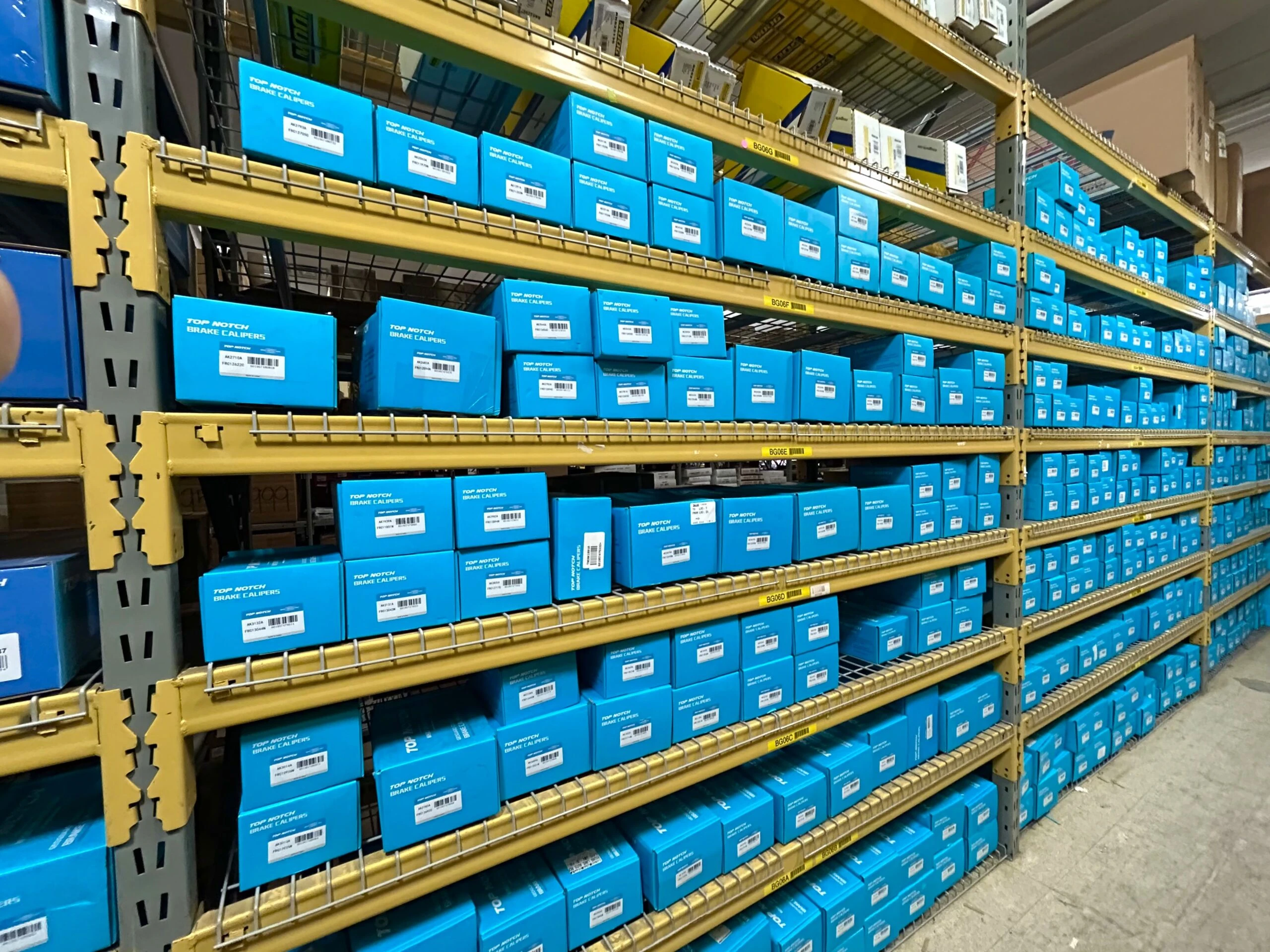 Rows of racks containing auto parts and auto related product that are stocked at United Auto Supply in Burnt Hills.