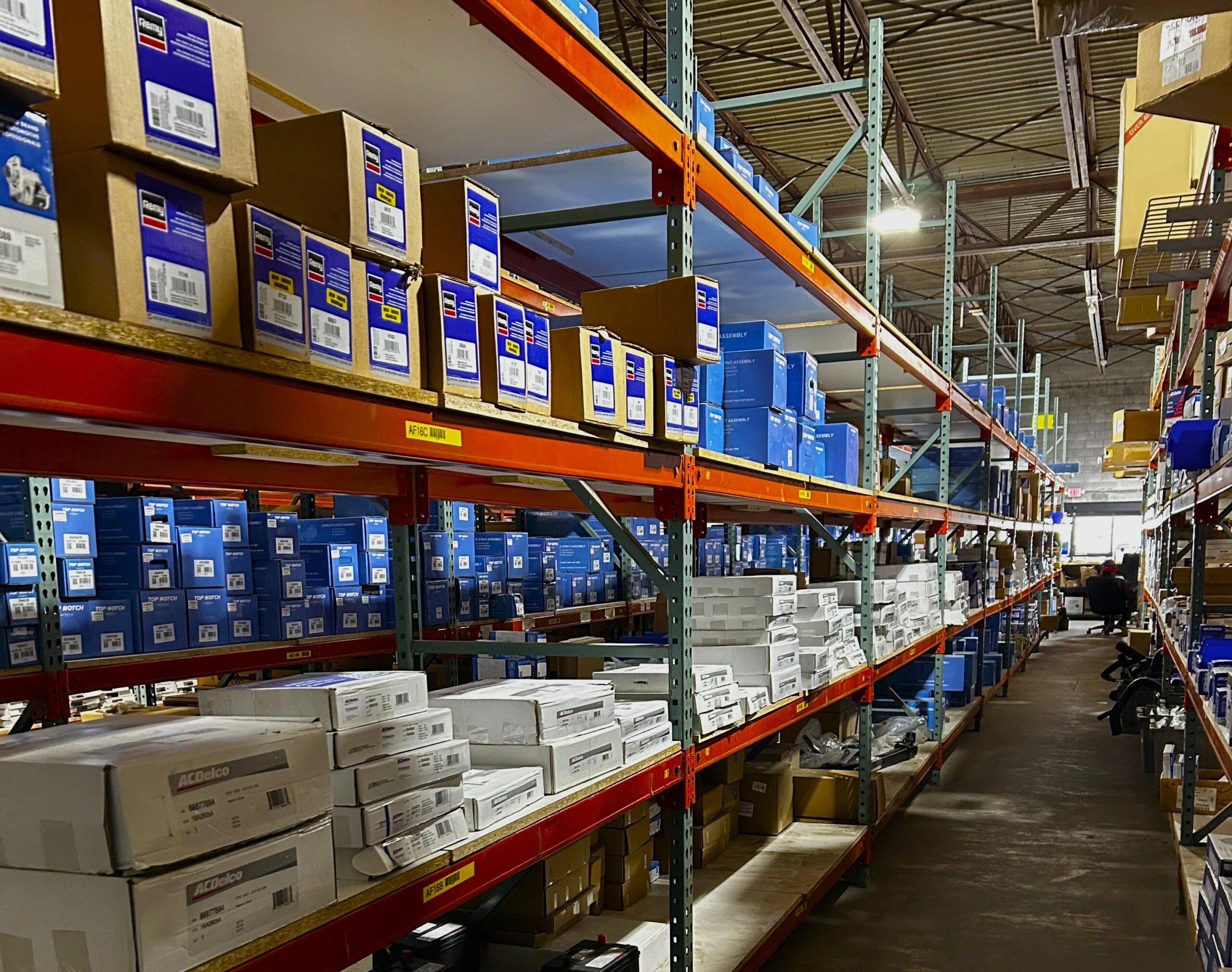 Rows of racks containing auto parts and auto related product that are stocked in United Auto Supply in Buffalo.